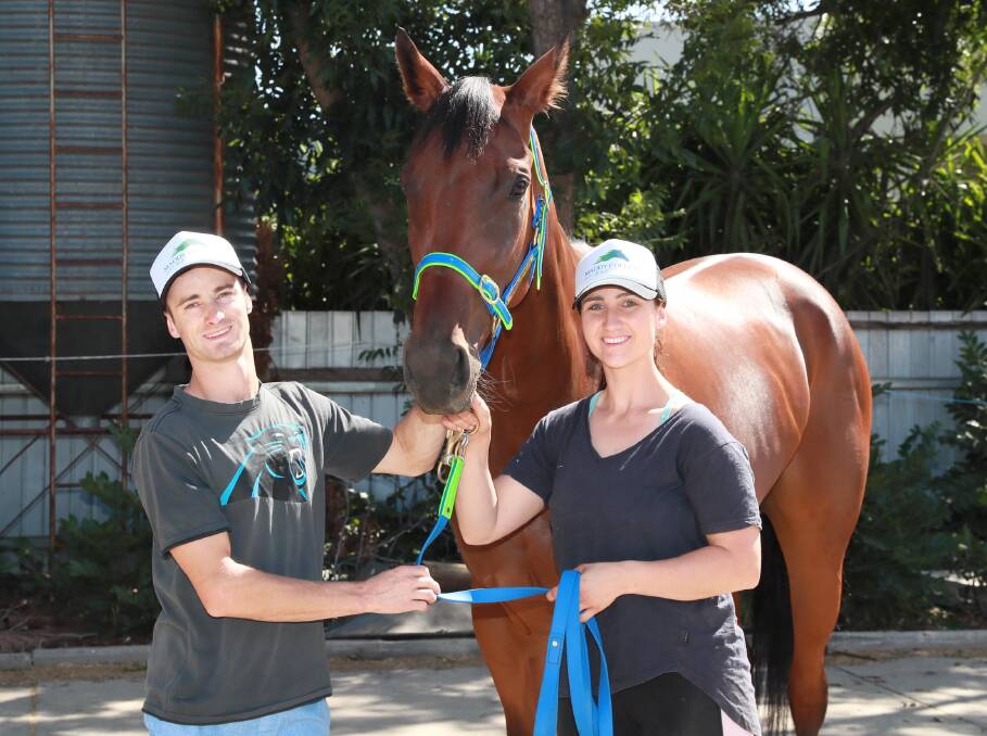 EXCITING TIMES: Wagga trainer Maddy Collins and apprentice jockey Josh Richards with Gotta Want It on Friday. Picture: Les Smith
