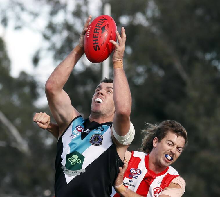 IN FRONT: Northern Jets' Brad McKinnon marks in front of Charles Sturt University's Steve Marsden in the Farrer League game at Peter Hastie Oval on Saturday. Picture: Les Smith