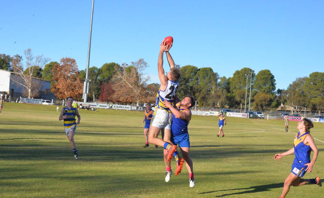 HIGH-FLIER: MCUE's George Kendall (23) reaches for the sky against
Narrandera in Riverina Football League at Narrandera Sportsground on
Saturday.