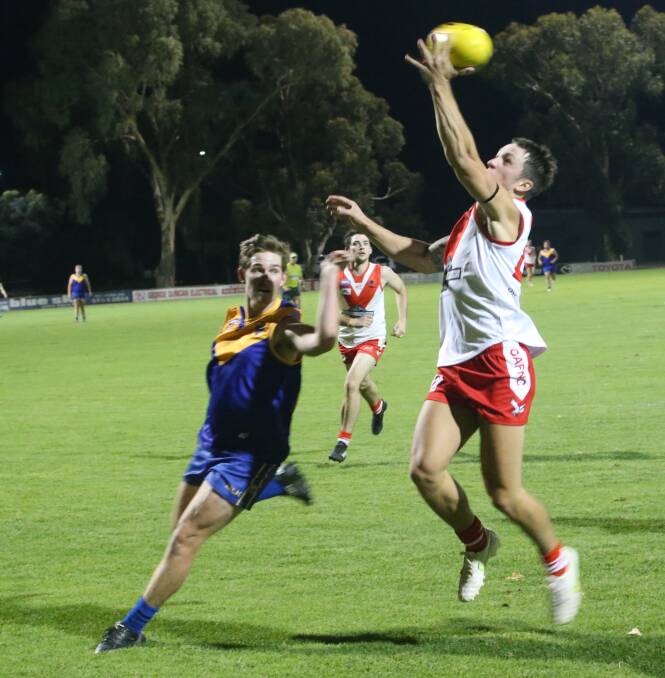 TOUCH: Narrandera's Cooper Irons and Griffith's Theo Valeri.