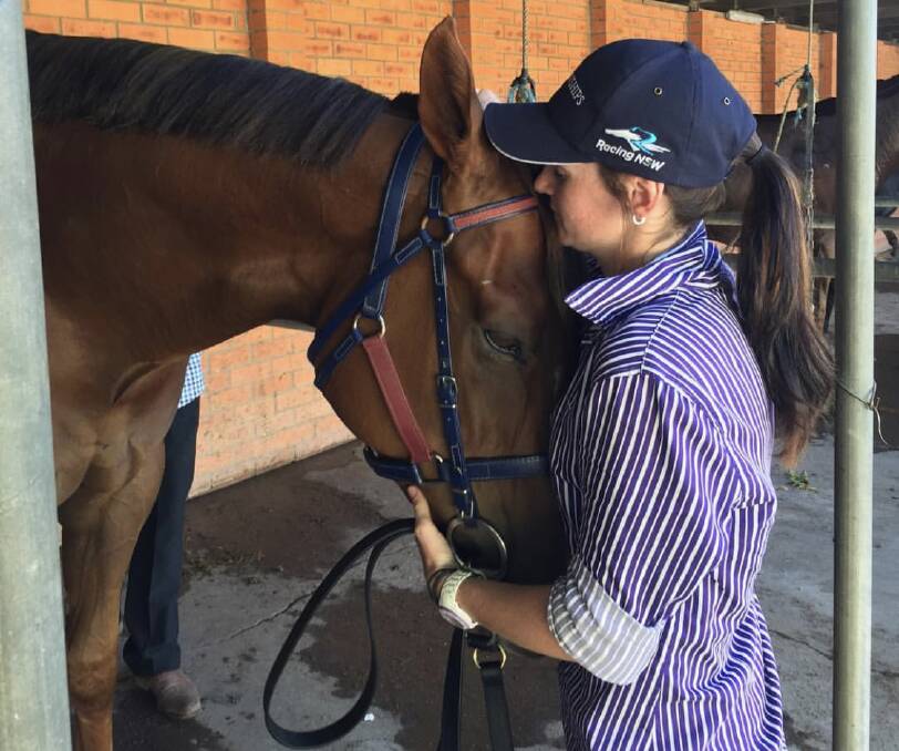 SPECIAL MOMENT: Goulburn apprentice jockey Angela Cooper gives some attention to Don't Give A Damn at the 2018 Country Championships WildCard at Muswellbrook last year. Picture: Julieanne Horsman