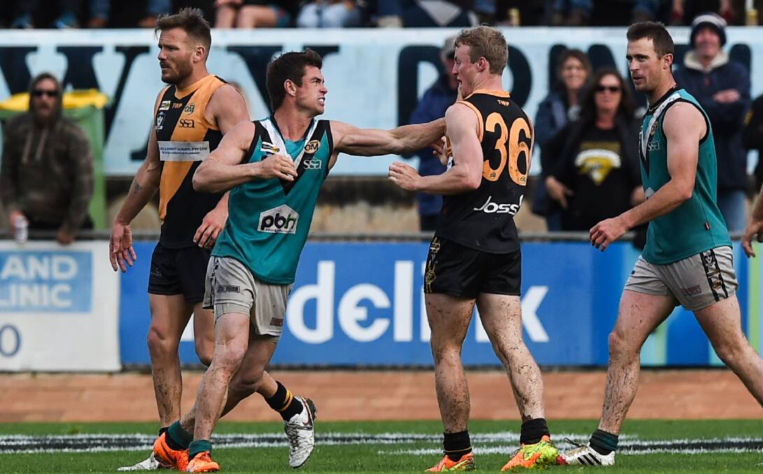 COMING HOME: Truman Carrol (left)l in action for Lavington in the Ovens and Murray League grand final against Albury Tigers last month. Picture: The Border Mail.