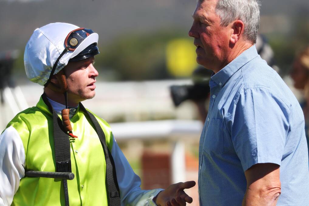 TROUBLE: Blaike McDougall and Gary Colvin discuss Coolyboss's run just moments before a protest was lodged at Wagga on Monday. Picture: Emma Hillier