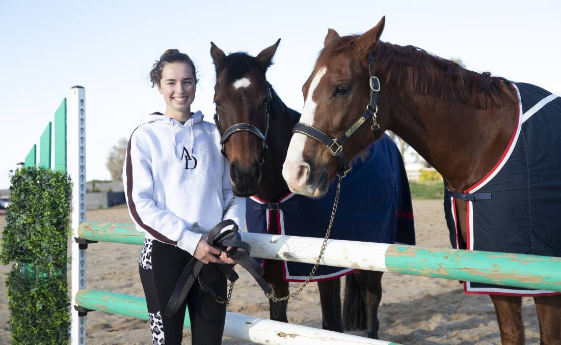 Indianna Cornius-Randall with horses Miranda and Spider at their home in Gregadoo. Picture: Madeline Begley
