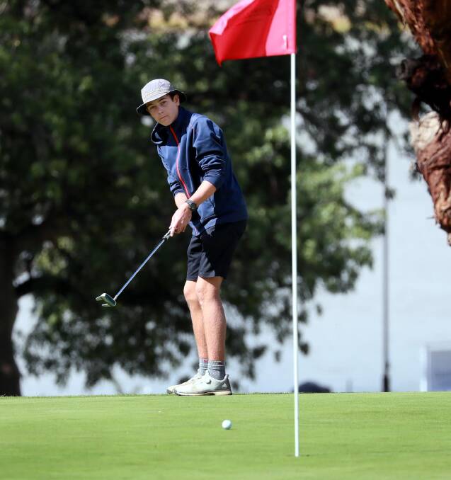 ON SONG: Isaac Molloy putts on the ninth green during a round at the Wagga Country Club last month. Picture: Les Smith