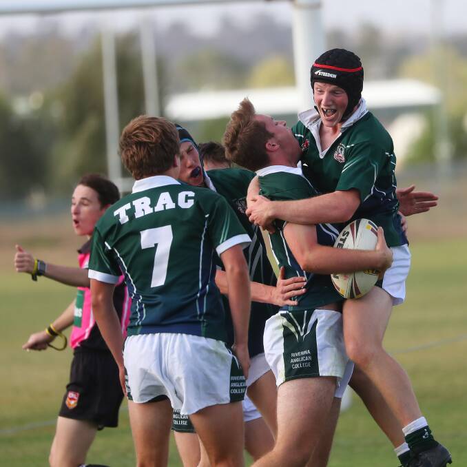 PARTY TIME: TRAC's Harry Byrnes and Brayden Begg celebrate the match-winning try in the Hardy Shield game against Kooringal High School at Parramore Park on Monday. Picture: Emma Hillier
