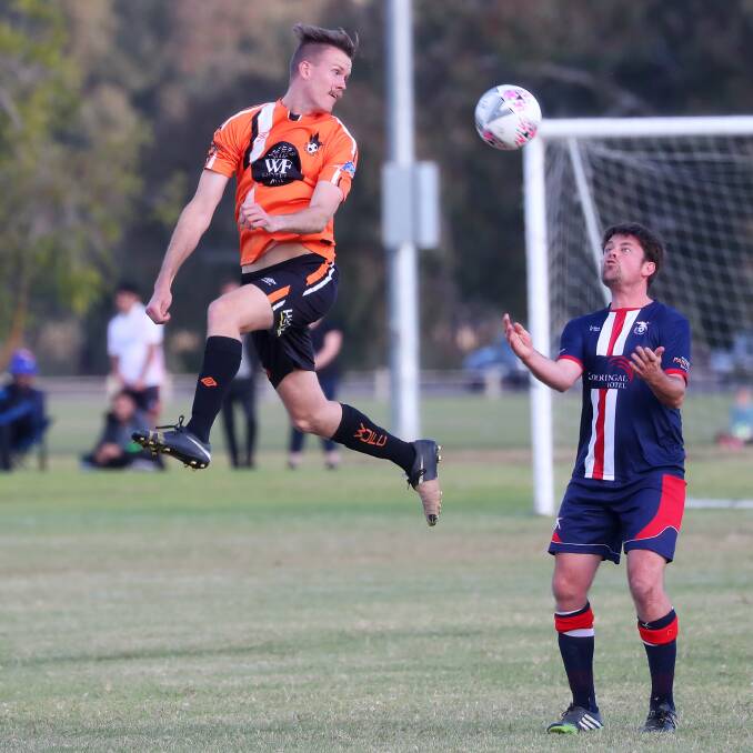 COME TO ME: Henwood Park co-coach Matt Menser prepares to receive the ball despite the best efforts of Wagga United's Aaron Harley in the Pascoe Cup game at Rawlings Park on Sunday. Picture: Emma Hillier