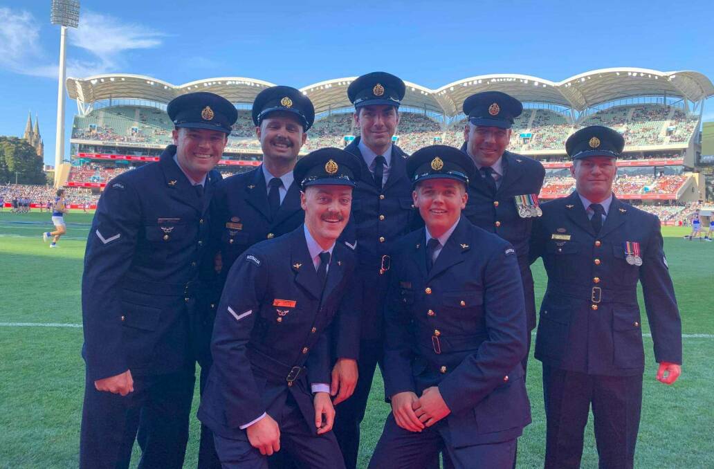 SPECIAL EXPERIENCE: Charles Sturt University assistant coach Jeff Ladd (far left) with fellow RAAF footballers at the Adelaide Oval on Saturday.