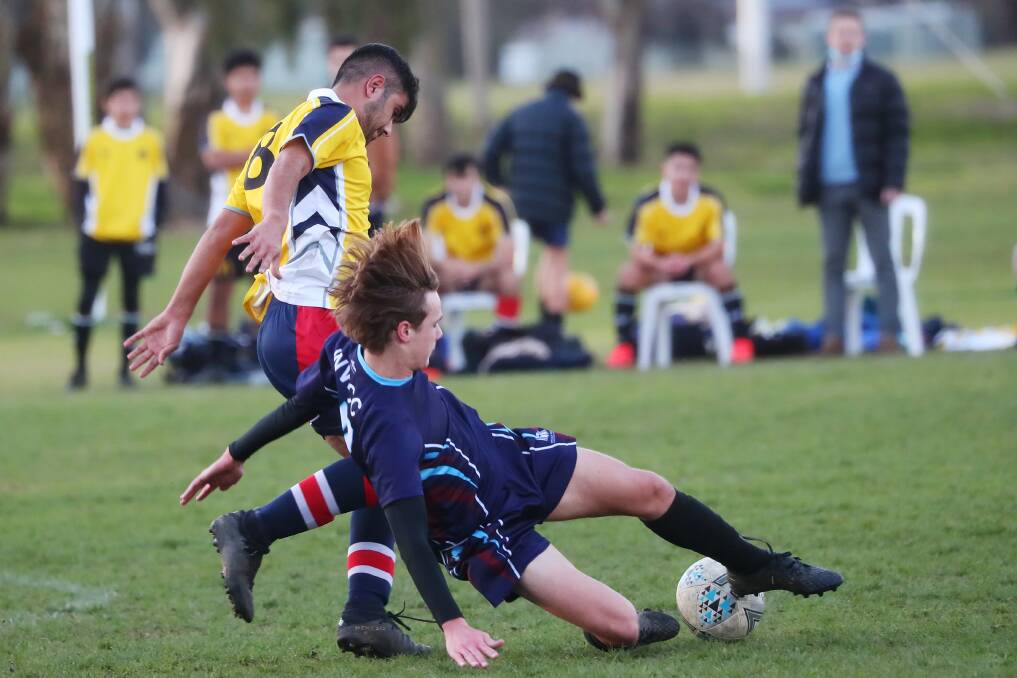 STRONG TACKLE: Wagga Christian College's Joe Skewes does not hold back during his tackle on Kooringal High School's Bahjat Smoqy in the Creed Shield semi-final at Rawlings Park on Monday. Picture: Emma Hillier