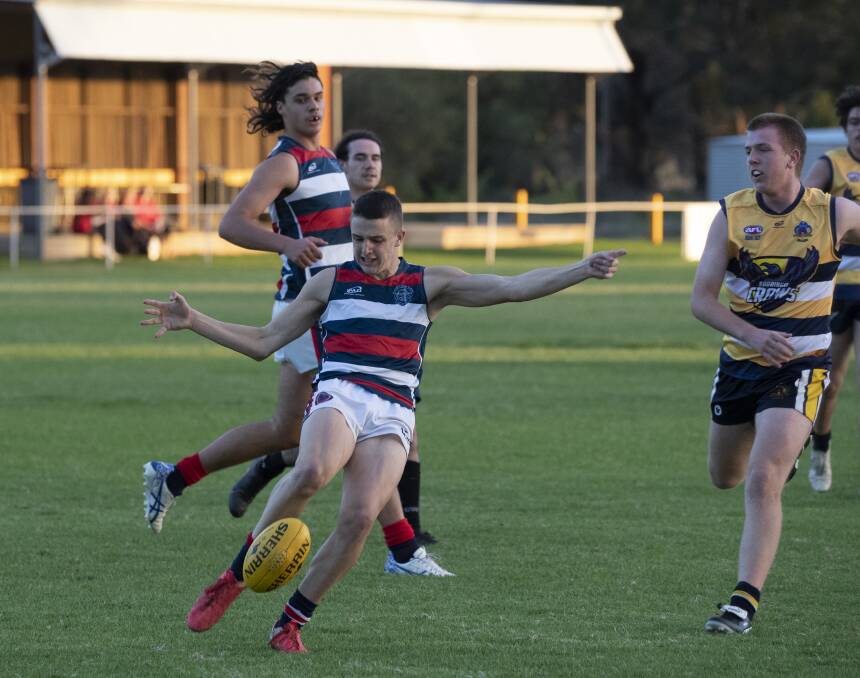 DRIVING FORWARD: Kildare Catholic College's Pat Ryan looks to send his team forward in the Carroll Cup game against Kooringal High School at Gumly Oval on Monday. Picture: Madeline Begley