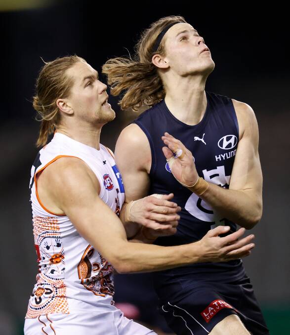 TEST OF STRENGTH: Greater Western Sydney's Harry Himmelberg battles it out with Carlton's Tom De Koning on Saturday night. Picture: Getty Images