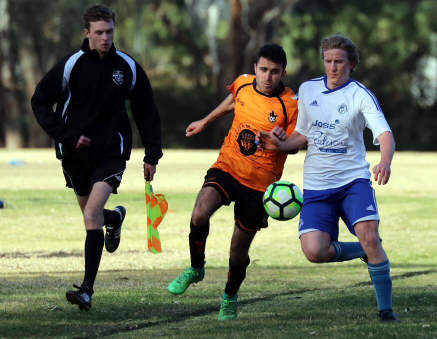 KICK OFF: The Pascoe Cup draw is out with the season to get underway this weekend. Wagga United's Nazar Yousif and Tolland's Mathew Kleine battle it out last season. Picture: Les Smith