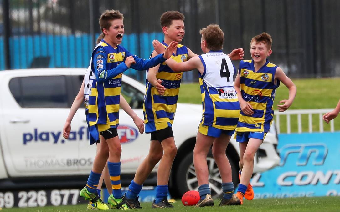 NO CHANGE: Eastlakes-MCU players celebrate their under 12 grand final against Wagga Swans back in September. Picture: Emma Hillier