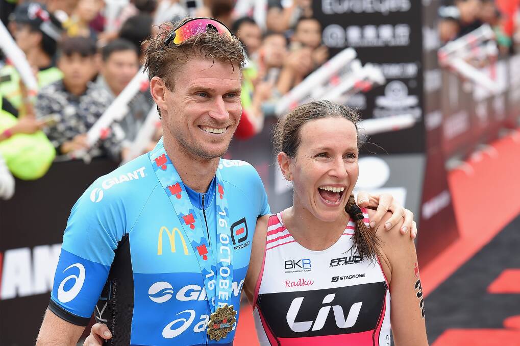 Brad Kahlefeldt and Radka Vodickova celebrate their victories in the Ironman 70.3 in Hefei, China. Picture: Getty Images