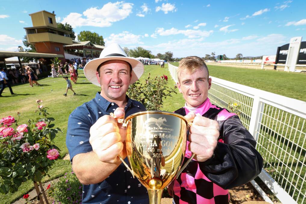 WINNERS: Craig Widdison and Jarrod Fry celebrate their Wodonga Gold Cup victory on Friday. Picture: James Wiltshire