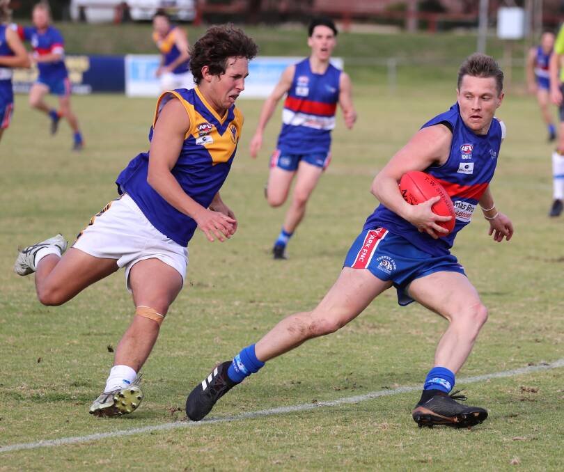 CATCH ME IF YOU CAN: Turvey Park's Daniel Hitchens gets away from Narrandera's Tom Savage at Maher Oval on Saturday. Picture: Les Smith