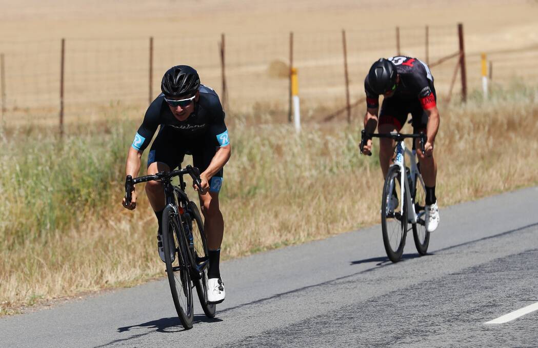 HOME: Myles Stewart breaks away from Will Silver to win Tolland Cycling Club's club championships at Uranquinty on Sunday. Pictures: Emma Hiller