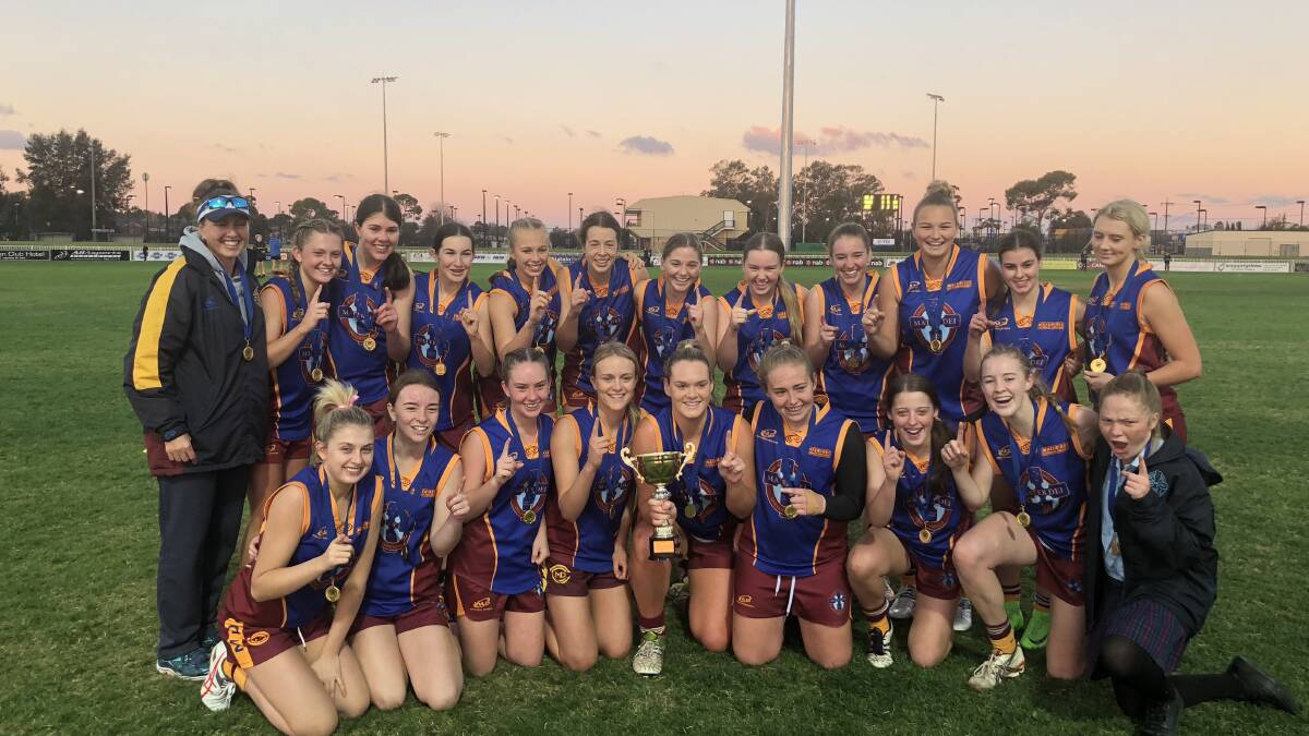 CHAMPIONS: Mater Dei Catholic College celebrate their opens girls final win at Robertson Oval on Wednesday night. Picture: Matt Malone