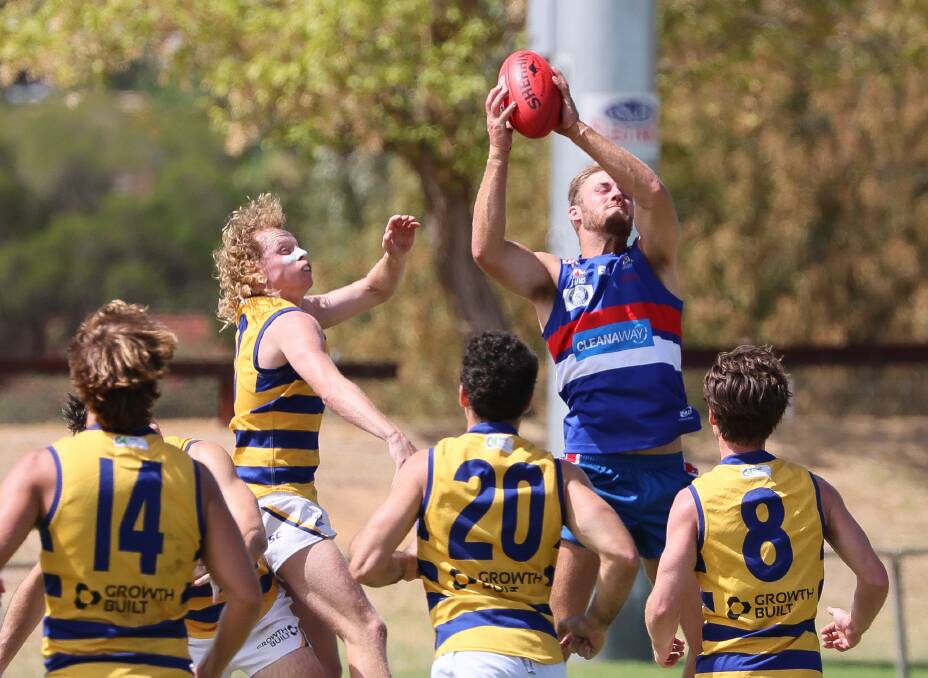 New Turvey Park full-forward Will Ford takes a strong grab against Sydney Uni in the pre-season trial game at Maher Oval on Saturday. Picture by Les Smith