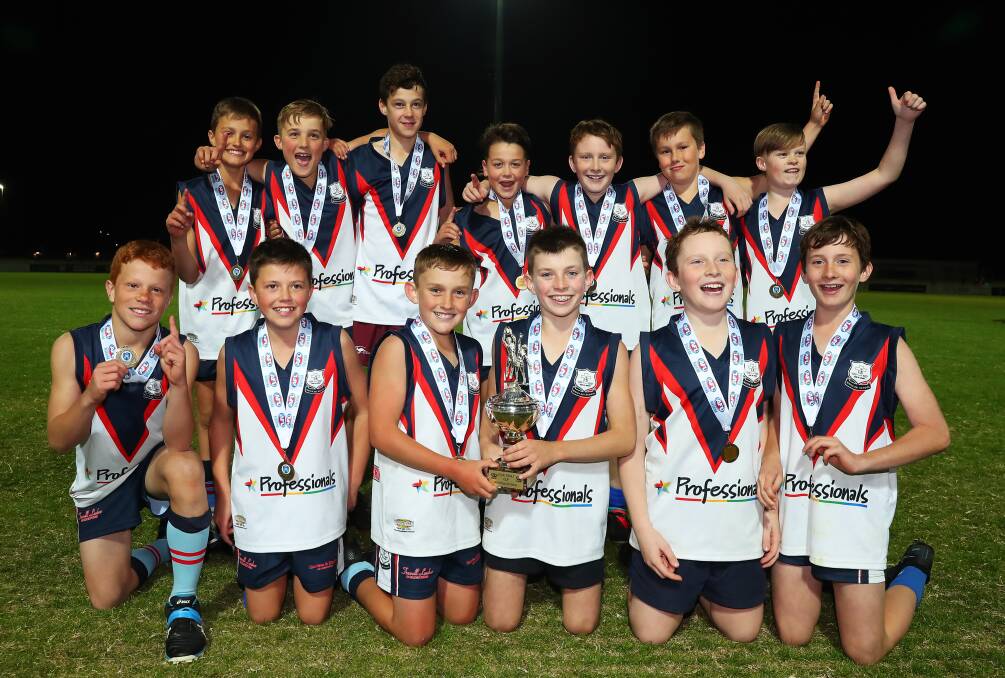 TOO GOOD: Mater Dei Primary School's boy's team enjoy their victory in the Paul Kelly Cup at Robertson Oval on Wednesday night. Pictures: Emma Hillier
