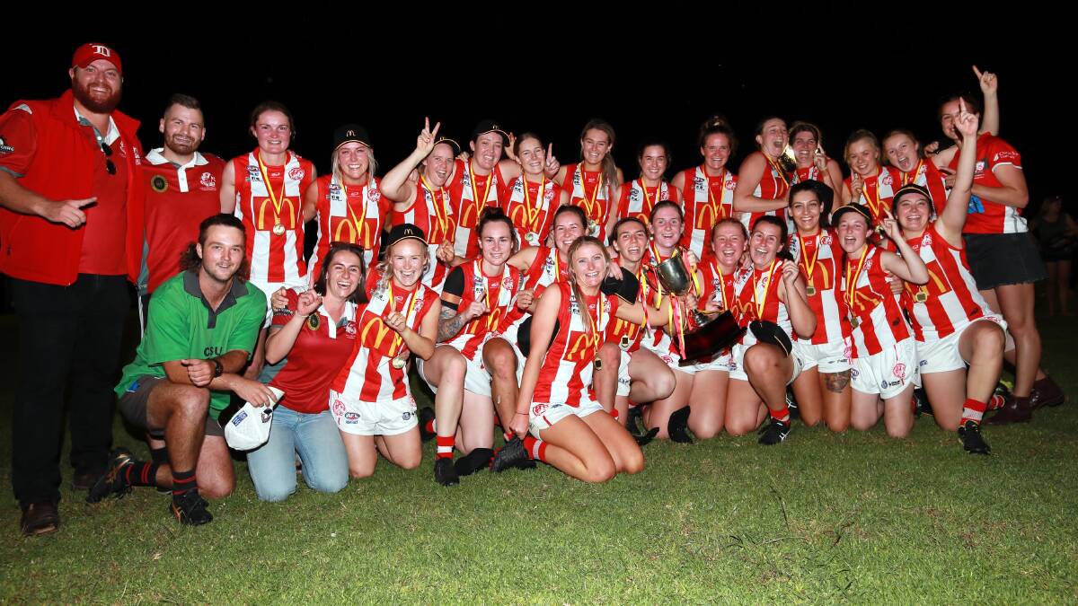 PREMIERS: Charles Sturt University celebrate their AFL Southern NSW Women's grand final win at Apex Park on Thursday night. Pictures: Les Smith