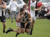 CRUNCH: North Wagga's Bailey Clark wraps The Rock-Yerong Creek's Aiden Ridley up with a strong tackle at Victoria Park on Saturday. Picture: Madeline Begley
