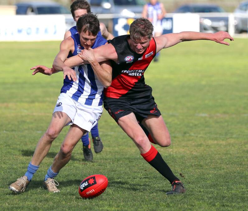 CONTEST: Temora's Rob Grant battles with Marrar's Nick Cooper in the Farrer League game at Langtry Oval on Saturday. Picture: Les Smith