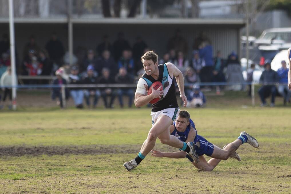 ON THE RUN: Northern Jets' Jack Harper escapes Temora's Liam Sinclair in the Farrer League game at Nixon Park on Saturday. Picture: Madeline Begley