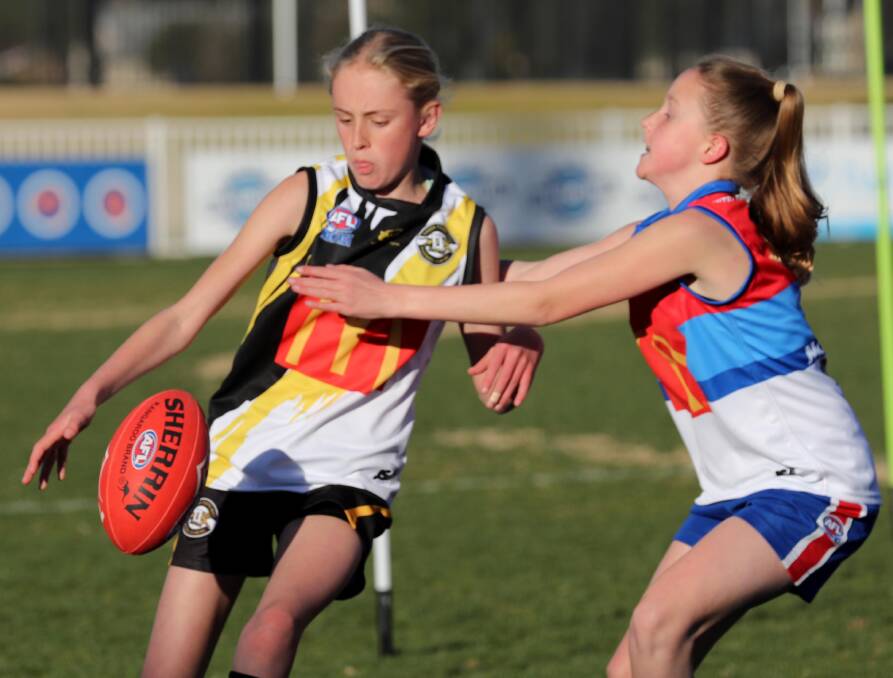 Wagga Tigers' Harriet Priest and Turvey Park's Maggie Hallcroft compete in last year's Wagga Youth Girls competition.