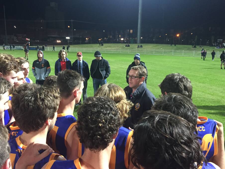 IN CONTROL: Mater Dei Catholic College coach Nathan Irvine talks to his team at three-quarter-time at Robertson Oval on Wednesday night.