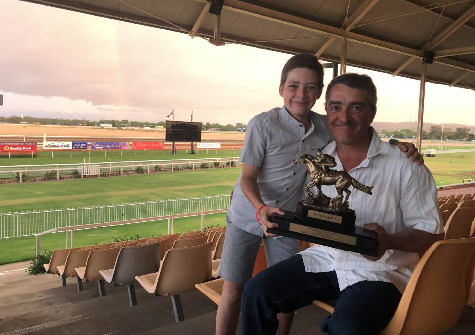 SPECIAL MOMENT: Oliver Spackman with dad, Scott, show off the SDRA Horse of the Year trophy, won by O' So Hazy. Picture: Matt Malone