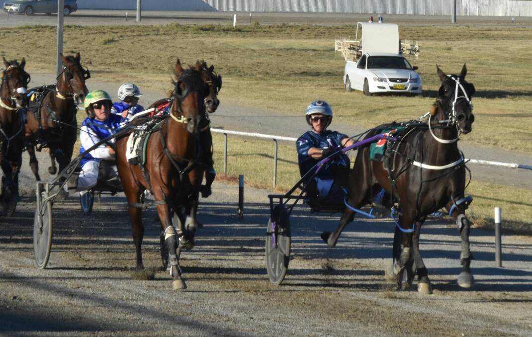 TOO GOOD: Nowhere Creek (right) takes out the first heat of the Junee Pacers Cup on Tuesday night. Picture: Courtney Rees