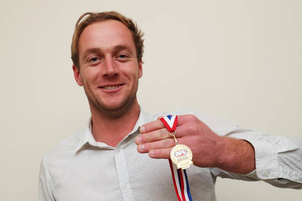 POPULAR WINNER: Narrandera coach Jarred Lane shows off his Jim Quinn Medal on Tuesday night. Picture: Emma Hillier