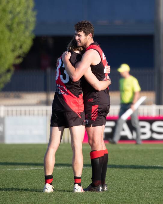 Marrar assistant coach Zach Walgers and captain Nick Molkentin console each other after the final siren. Picture by Madeline Begley