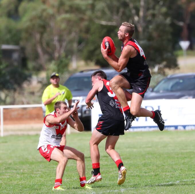 FLYING START: Marrar forward James Lawton takes a big mark over Bombers teammate Chris O'Donnell in Saturday's trial game against Griffith at Langtry Oval. Picture: Emma Hillier