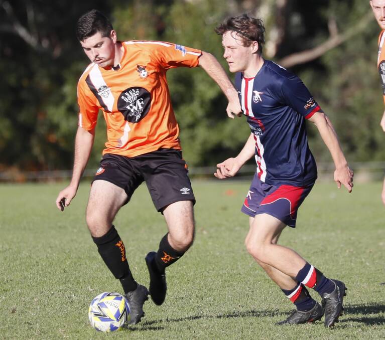 PRESSURE'S ON: Wagga United's Damon Hardinge protects the ball from Henwood Park opponent Matt Cain in a Pascoe Cup game earlier in the year. Picture: Les Smith