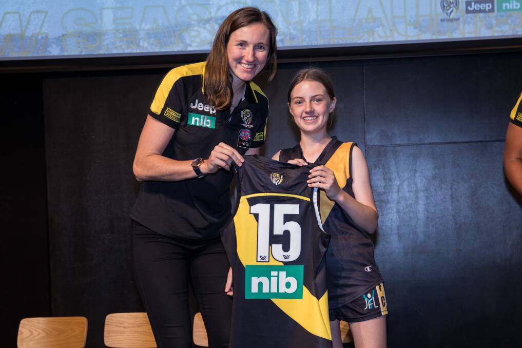 DREAM COME TRUE: Former Wagga schoolgirl Rebecca Miller (left) with her number 15 Richmond jumper. Pictures: Supplied