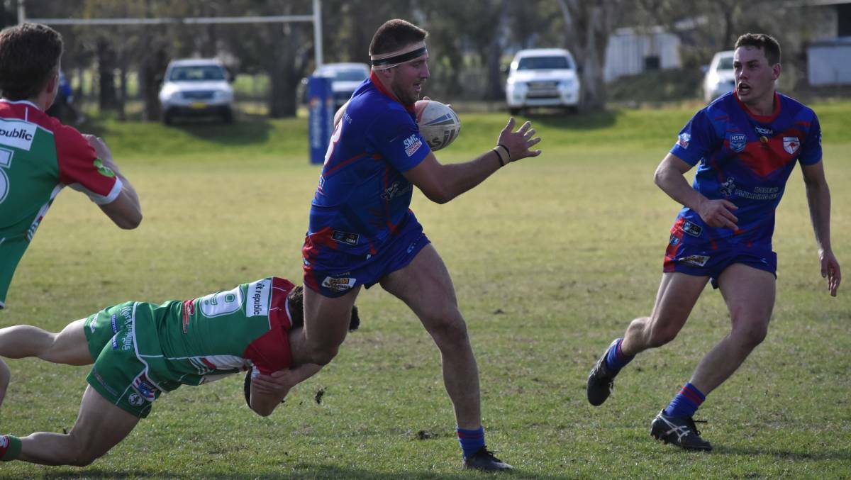 Luke Ingram looks to break out of Wilson Hamblin's tackle attempt as Kangaroos scored a 28-10 win over Brothers on Saturday. Picture: Courtney Rees