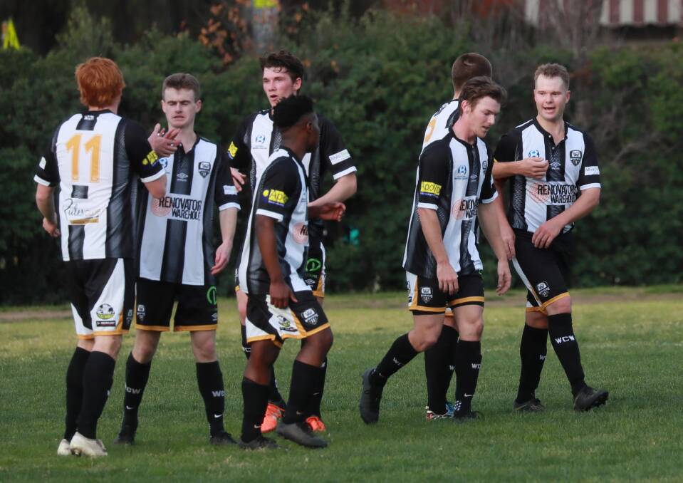 Wagga City Wanderers celebrate a goal at Gissing Oval on Saturday. Picture: Les Smith