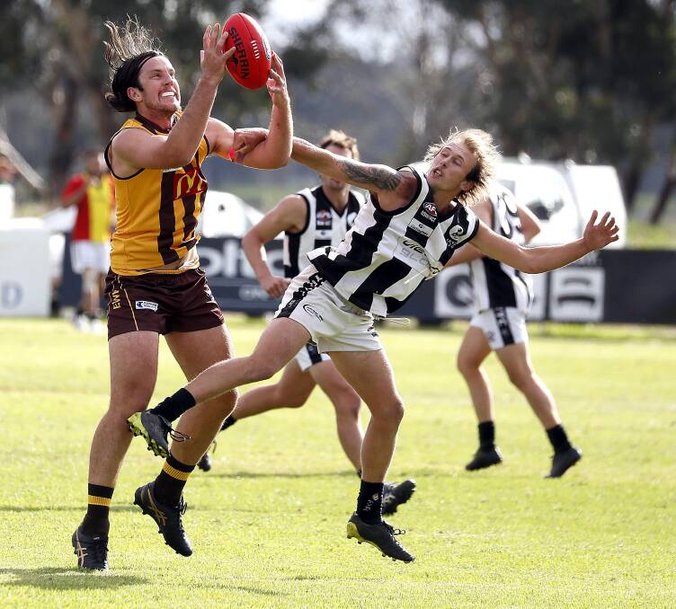 TOO STRONG: East Wagga-Kooringal's Wilson Thomas marks in front of The Rock-Yerong Creek's Tom Collins at Gumly Oval on Saturday. Picture: Les Smith