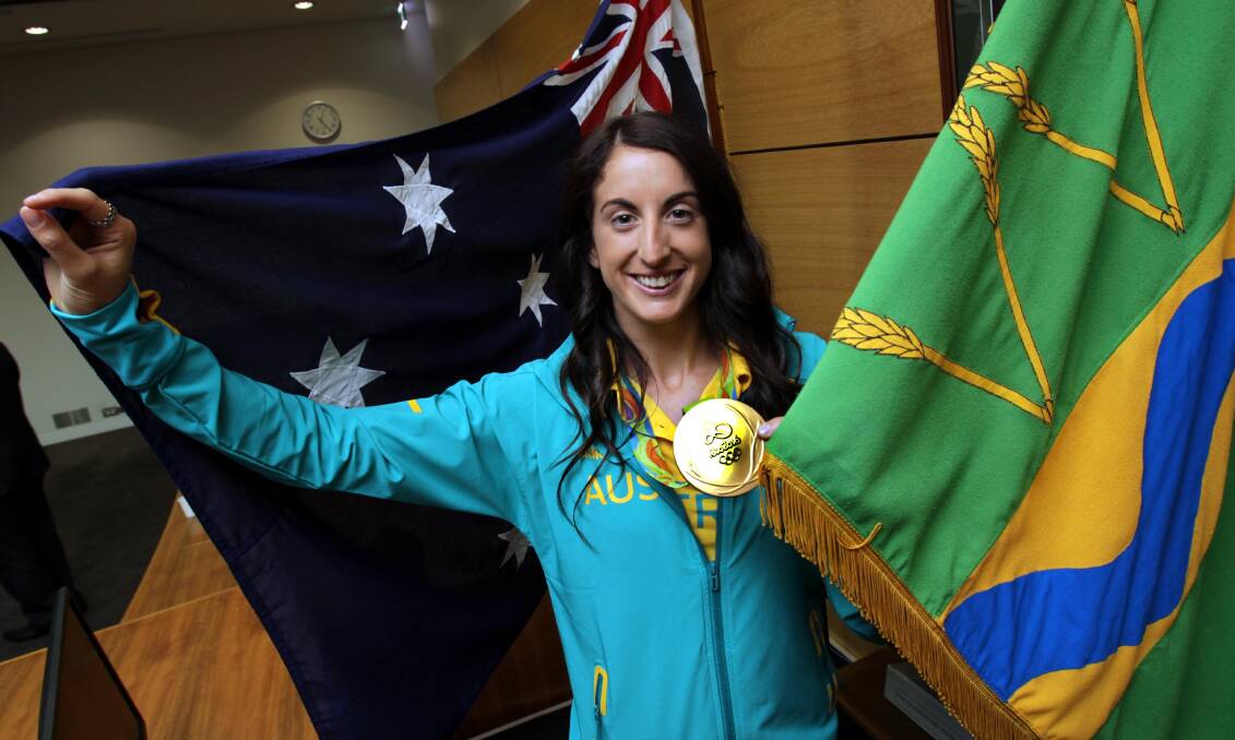 GOLDEN GIRL: Alicia Lucas shows off her Olympic gold medal at a civic reception in Wagga back in 2016. Picture: Les Smith
