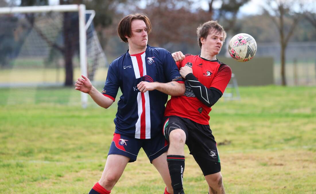 JOSTLING: Henwood Park's Ned Evans and Lake Albert's Christopher Durman compete for the ball in the Pascoe Cup game at Forest Hill on Sunday. Picture: Emma Hillier