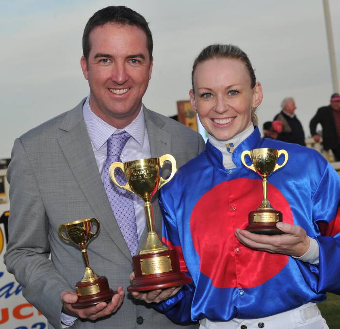 TEN YEARS AGO: Nick Olive and Kathy O'Hara show off their spoils after winning the 2011 Wagga Gold Cup with Voice Commander. Picture: Les Smith