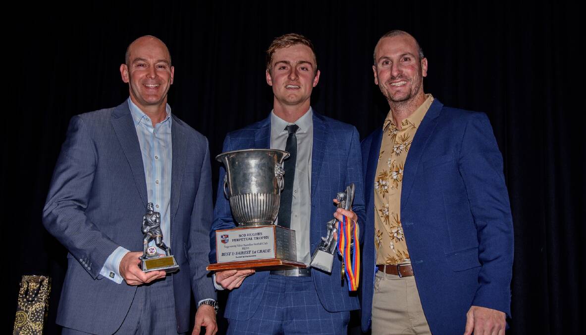Rhys Mooney (middle) with Tuggeranong's best and fairest trophy. He credits coach Jim Rice (right) for a lot of his development over the past two years. Picture by Waz Shots