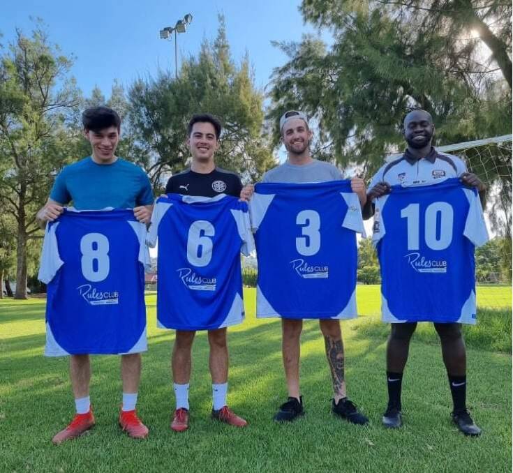 BACK IN BLUE: Thomas Sutton, Kaylem Fitzpatrick, Isaac Devries and Daniel Okot show off their new Tolland jumpers at training on Monday night.