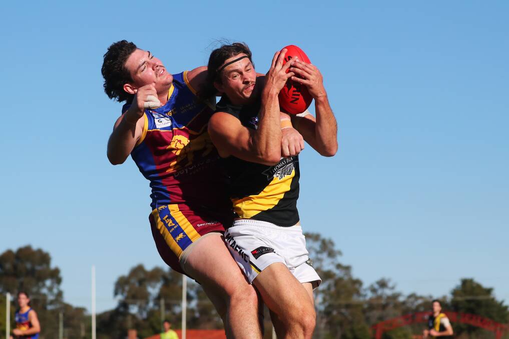 STRONG: Wagga Tigers defender Reid Gordon marks in front of Ganmain-Grong Grong-Matong's Riley Corbett at Ganmain Sportsground on Sunday. Picture: Emma Hillier
