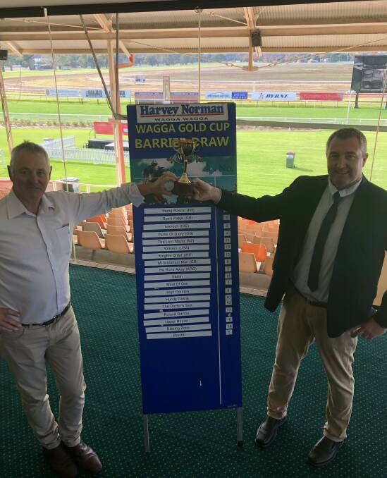 READY TO GO: Murrumbidgee Turf Club president Geoff Harrison and chief executive Steve Keene with the final field on Wednesday. Picture: Matt Malone
