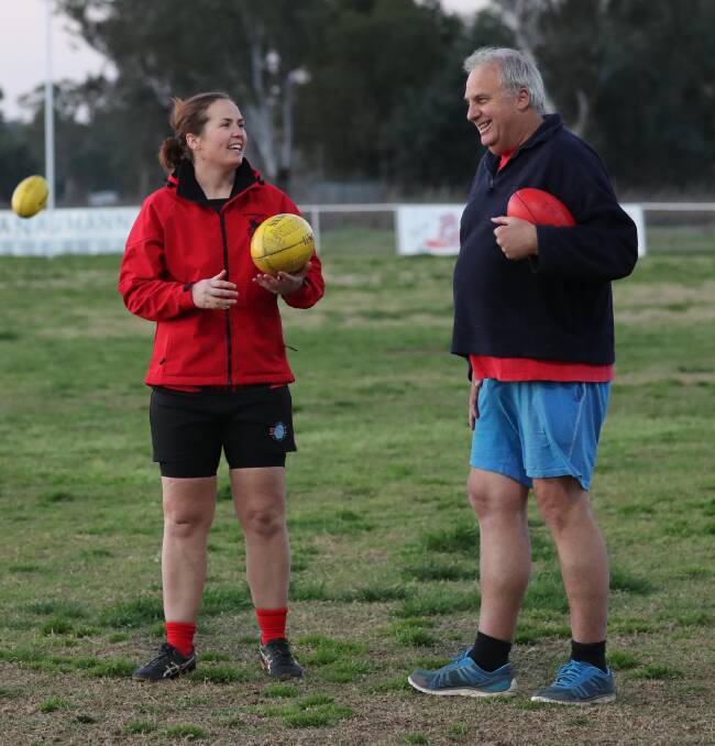 Riverina Lions coach Jed Lawton shares a laugh with Jack Powell at training on Wednesday night. Picture: Les Smith