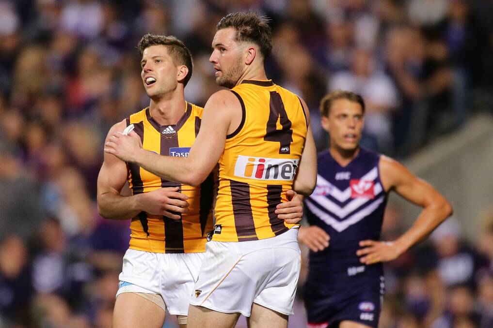 Former Hawthorn teammates Luke Breust and Matt Suckling will come together for a sportsmen's night at Gumly Oval Hall next month. Picture by Will Russell-Getty Images