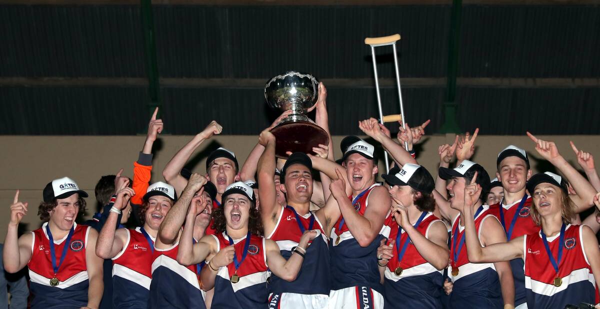 WINNERS ARE GRINNERS: Kildare Catholic College celebrate their Carroll Cup win at Robertson Oval on Wednesday night. Picture: Les Smith
